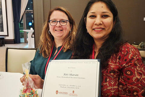 Dr Ross and Dr. Sharan with the Award
